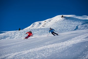 2 Skifahrer auf der Skischaukel Dorfgastein-Großarl
